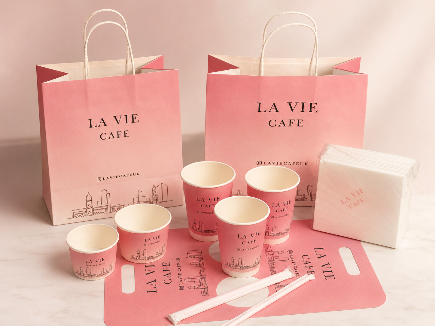 La Vie Cafe branded paper bags, paper cups, napkins and accessories